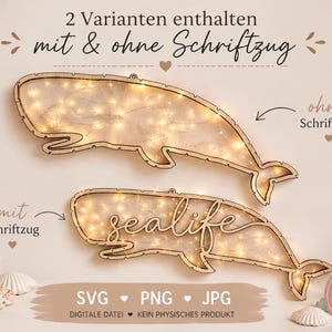 May include: Two wooden whale-shaped wall decorations with internal lights. One whale has the word "sealife" in cursive. The other whale is plain. The image also includes a vase with dried plants, seashells, and a jar with lights.