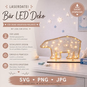 May include: A wooden polar bear LED decoration with warm white lights. The bear is standing on a wooden base. The image also includes text that says "LASERDATEI Bär LED Deko" and "SVG PNG JPG".