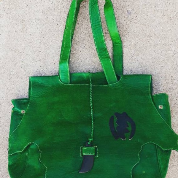 Ghanaian Gye Nyame Leather bag with handwoven fugu.
