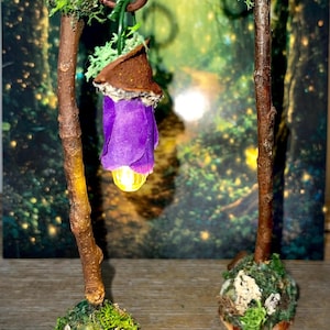 May include: A white ceramic mug with a black handle and the text "But First, Coffee" in a black, handwritten-style font. The mug is on a white surface.