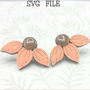 May include: A pair of peach-colored flower earrings with brown centers. The earrings are made of wood and have a delicate, feminine design. Glowforge Ready SVG FILE. Not a physical product.