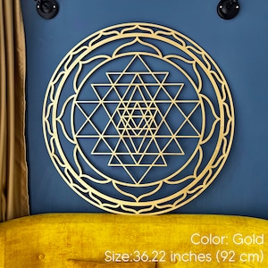 May include: Gold-colored metal Sri Yantra mandala wall decor with a geometric design. Size: 36.22 inches (92 cm).