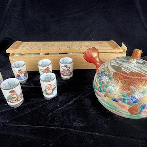 Hand Painted (Inside & Outside) Saki Set in Wooden Box (Kutani Kazan Japanese Showa Kutani 7 Lucky Gods Sake Set – missing one) Excellent