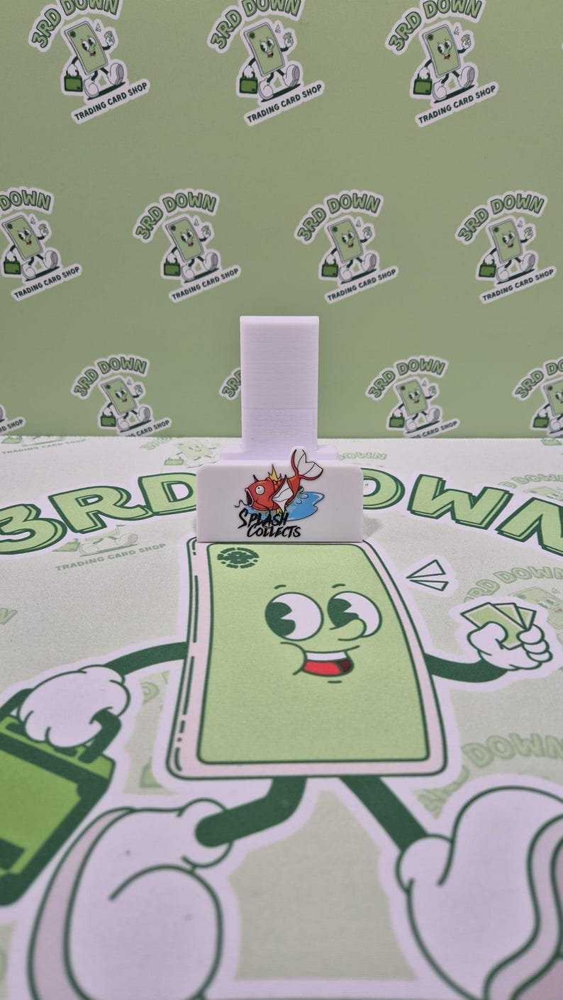 May include: White plastic card holder with a red fish logo that says "Splash Collects".