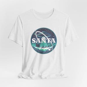 Funny UFO Christmas Santa in Space Shirt, Astronaut Christmas shirt, UFO Santa Holiday, Cosmic Santa Tee, Space Xmas Unisex Tee