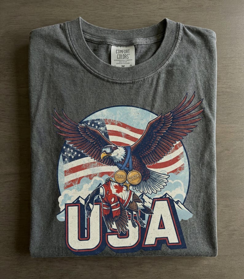 Funny USA Ice Hockey Eagle, USA Champions 2026 Shirt, USA Hockey Shirt 2026, Patriotic Ice Hockey Tee, Funny Sports Unisex T-shirt Pepper
