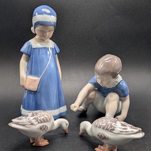 Bing Grondahl Girl & Boy Feeding Geese Figurines: Girl, Else #1574;  Boy, Dickie #1636; (2) Goose #1902. Copenhagen, Denmark – 4-Piece Set