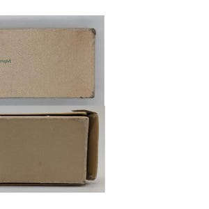May include: A cardboard box with the text "Venus  -  Hamburg" printed on the top.