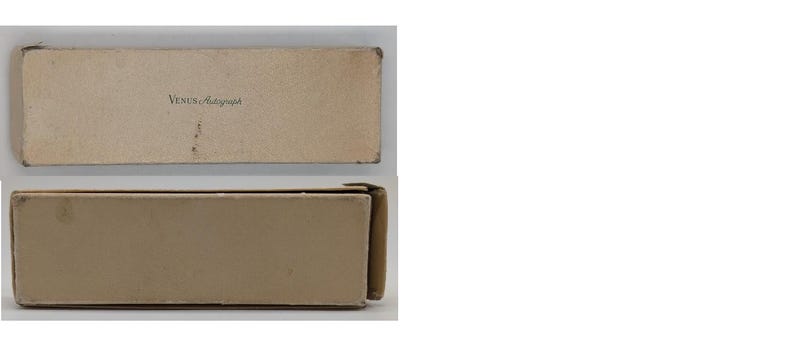 May include: A cardboard box with the text "Venus  -  Hamburg" printed on the top.