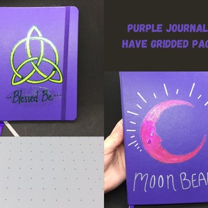 May include: Two purple journals with different designs. The first journal has a green and yellow triquetra symbol with the text "...Blessed Be..." The second journal has a pink crescent moon with white rays and the text "Moon Beam". Both journals have gridded pages.