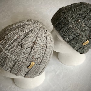 Wool hand knitted beanie hat.  Fits men or women. Wool  mix tweed yarn. Very stretchy, warm and retains shape well. Several colours