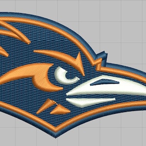 May include: An embroidered patch featuring a blue and orange bird with a white beak and eye. The bird is facing right and has a fierce expression.