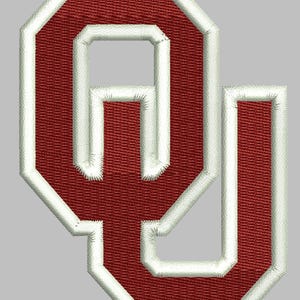 May include: A red and white felt patch with the letter "O" in a stylized font. The letter is outlined in white and has a white inner border.