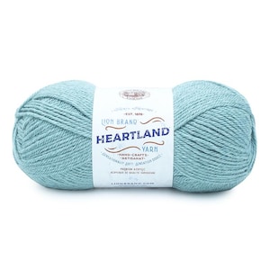 May include: A skein of Lion Brand Heartland yarn in the color "Aqua" is shown. The yarn is a soft, premium acrylic and is perfect for hand-crafts. The label reads "Hand-Crafts - Artisanat - Sensationally Soft - Sensation Douce - Premium Acrylic - Acrylique de Qualite Superieure - LionBrand.com".