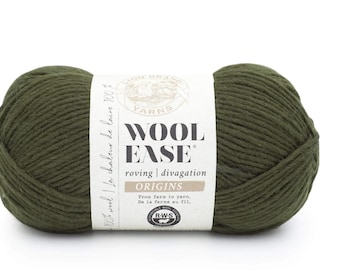 May include: A skein of olive green Wool-Ease Origins yarn. The label reads "Wool Ease" and "Origins". The yarn is a roving style, suitable for knitting and crocheting projects. The label also includes the text "From farm to yarn, de la ferme au fil."