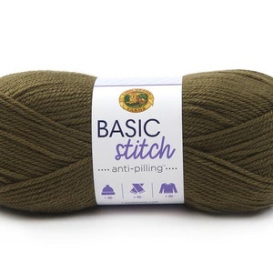 May include: A skein of Lion Brand Yarn Basic Stitch in the color Olive. The label reads "Basic Stitch... anti-pilling..." and shows a hat, scarf, and sweater.
