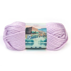 May include: A skein of lavender-colored yarn labeled "Hometown Little Braid Yarn".