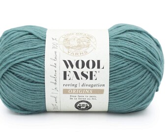 May include: A teal-colored ball of Lion Brand Wool-Ease yarn. The label reads "Wool Ease Origins" and includes text in French. The yarn is 100% wool and is suitable for knitting and crochet projects.