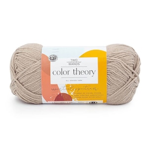 May include: A skein of beige yarn labeled "Two Wands Color Theory All Season Yarn" with the tagline "Essential Spectrum: An array of colors chosen to work together harmoniously or stand alone effortlessly."
