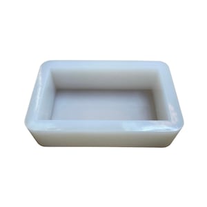 May include: A white rectangular silicone mold for making soap or other crafts.