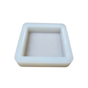 May include: A white silicone mold for making square-shaped soap or resin crafts.
