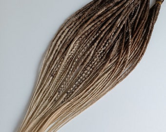Brown ombre dreadlocks. Synthetic dreadlocks in various textures. Thin, natural-looking dreadlocks. Light brown DE and SE dreadlocks.