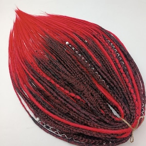 Red and black dreadlock extensions.Mixture of synthetic dreadlock textures and handmade braids.Thin DE&SE dreadlocks in black, free ends red