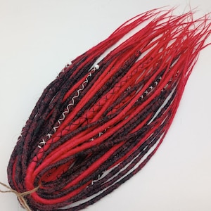 Dreadlocks mix of black and red. Viking dreadlocks. Synthetic extension of black and red dreadlocks. Classic double and single dreadlocks