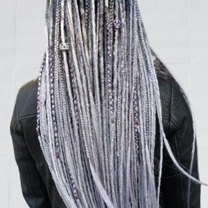 Mixed dreadlocks in black, gray, and purple. Mixed textures. Gray dreadlocks with purple highlights. Dark and light dreadlocks.