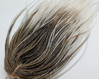 Extensions of thin dreadlocks and boho braids/extensions of dreads light brown, white/dreadlocks, braids DE/dreadlocks in boho style