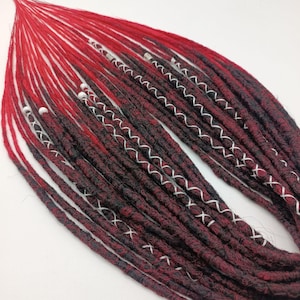 Dreadlocks mix black and red. Crochet dreadlocks red. Synthetic dreadlocks black. Red black double and single dreadlocks.