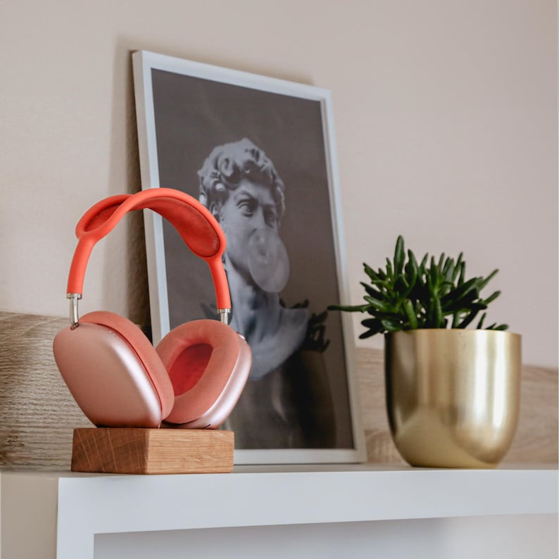 Oak wireless magnetic charging stand with AirPods Max, showcasing a sleek and minimalist design for effortless charging and a stylish workspace