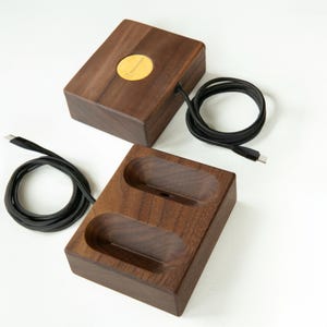 The walnut wireless magnetic charging stand with AirPods Max, demonstrating a sleek, handcrafted design that enhances your workspace while providing efficient, seamless charging