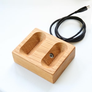 Oak wireless magnetic charging stand with AirPods Max, showcasing a sleek and minimalist design for effortless charging and a stylish workspace