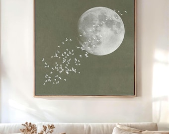 May include: A digital art print featuring a large, white moon with a flock of white birds flying around it. The background is a muted green colour.