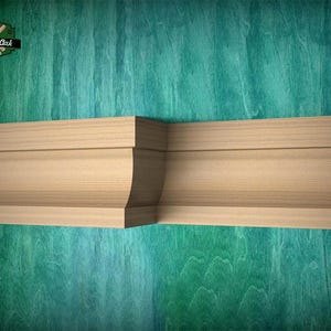 May include: A light-colored wooden crown molding piece featuring a curved profile and a flat top edge. The molding has a distinct corner section and a smooth, natural wood grain finish. The Master Oak logo is visible in the top left corner.