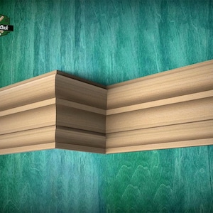 May include: A light-colored wooden crown molding piece featuring a multi-tiered profile with rounded edges and horizontal grooves, arranged in an L-shape corner configuration. The logo Master Oak Since 1990 is visible in the top left corner.