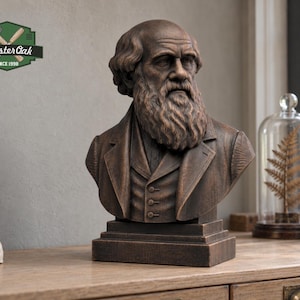 May include: A bronze-toned bust of a bearded man with a receding hairline, wearing a collared jacket and vest. The sculpture sits on a rectangular base. A logo in the upper left corner displays a hammer and chisel icon with the text MasterOak SINCE 1998.