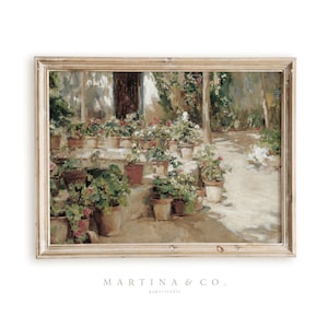 May include: A framed painting of a garden scene with a path leading through a courtyard filled with potted plants. The plants are in various shades of green and have pink flowers. The painting is in a light wood frame.