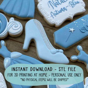May include: A digital download of STL files for 3D printing at home. The image shows a collection of blue and white cookies decorated with Cinderella-themed designs, including a glass slipper, a carriage, and a dress. The text "INSTANT DOWNLOAD - STL FILE" and "FOR 3D PRINTING AT HOME - PERSONAL USE ONLY" is displayed on the image. The text "*NO PHYSICAL ITEMS WILL BE SHIPPED*" is also displayed on the image.