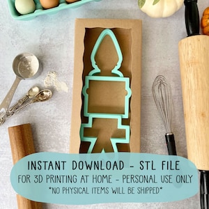 May include: A teal blue 3D printed cookie cutter in the shape of a candle. The cookie cutter is in a brown cardboard box. The text "INSTANT DOWNLOAD - STL FILE FOR 3D PRINTING AT HOME - PERSONAL USE ONLY *NO PHYSICAL ITEMS WILL BE SHIPPED*" is on a teal blue background.
