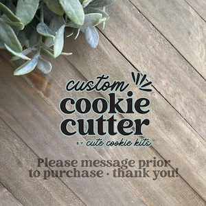 May include: A wooden background with a black and white graphic that says "custom cookie cutter by cute cookie kits". The text below says "Please message prior to purchase. Thank you!"