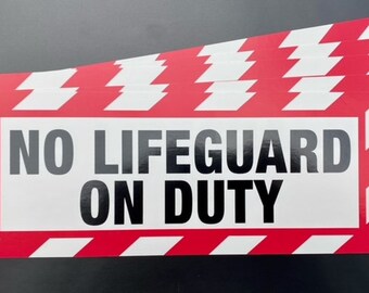May include: A red and white striped sign with the text "NO LIFEGUARD ON DUTY" in black letters.