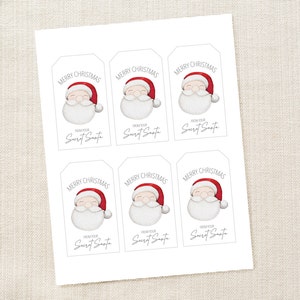 May include: Printable gift tags featuring a cartoon Santa Claus with the text "Merry Christmas" and "From your Secret Santa".