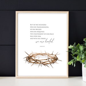 May include: A printable art print with a watercolor illustration of a crown of thorns. The print features a Bible verse from Isaiah 53:5, "But he was wounded for our transgressions, he was bruised for our iniquities: the chastisement of our peace was upon him: and with his stripes we are healed."