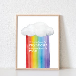 May include: A framed print with a watercolor illustration of a rainbow emerging from a white cloud. The text reads "I like to look for rainbows whenever there is rain."
