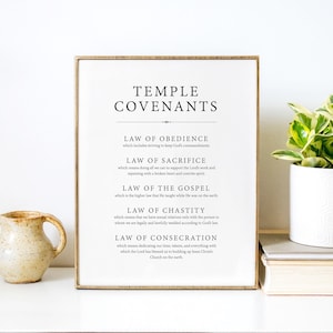May include: A framed printable with the text "Temple Covenants" and a list of five laws: Obedience, Sacrifice, the Gospel, Chastity, and Consecration. The text is in black font on a white background.
