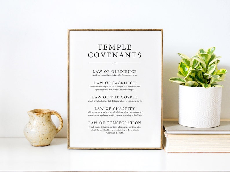May include: A framed printable with the text "Temple Covenants" and a list of five laws: Obedience, Sacrifice, the Gospel, Chastity, and Consecration. The text is in black font on a white background.