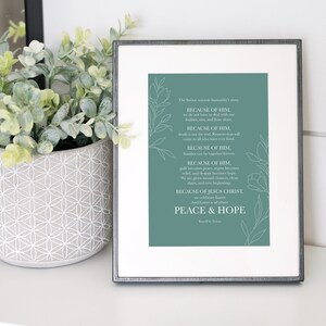 May include: A teal framed print with a white background and white floral designs. The text reads "The Savior's love illuminates our lives... BECAUSE OF HIM, we should love one another with pure hearts, minds, and strength, BECAUSE OF HIM, death is not the end, because every soul will come to all who have loved him, BECAUSE OF HIM, families can be together eternally, BECAUSE OF HIM, grief and sorrow become hope, relief, and peace, BECAUSE OF HIM, we are given strength, courage, and hope, joy, peace, and new beginnings, BECAUSE OF JESUS CHRIST, All Love is all around, PEACE & HOPE, David M. Stevenson"