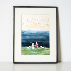 May include: Framed watercolor art print featuring a religious scene. The artwork depicts angels, shepherds, and sheep under a blue and yellow sky. The text "Glory to God in the highest, and on earth peace, good will toward men" is included.